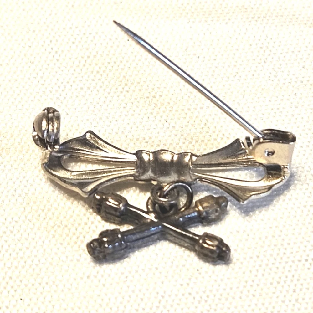 Vintage Silver-Tone Bow Pin with Crossed Batons Charm
